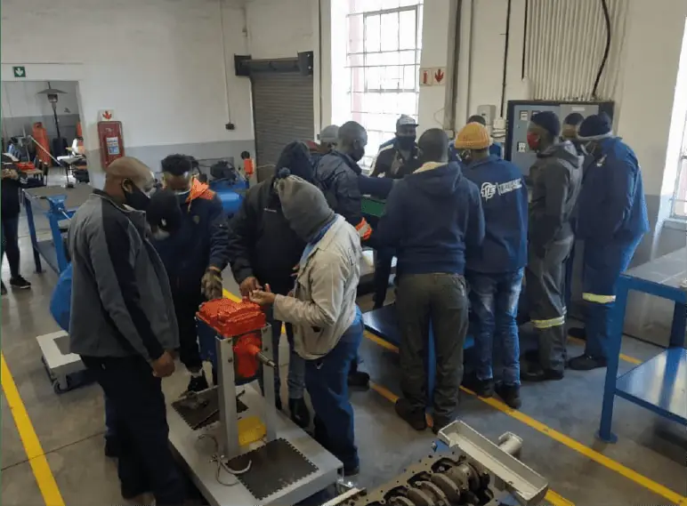 MM Engineering trainees and instructor working on a training rig in the Wynberg workshop