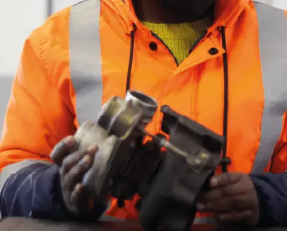Trainee working on vehicle parts during the Motor Mechanics course